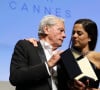 Alain Delon (avec un badge Paris Match d'une ancienne couverture du magazine titrant "Alain Delon, mes deux amours, Rosalie et Anouchka) et sa fille Anouchka (Robe Elie Saab) - Remise de la Palme d'Honneur à Alain Delon lors du 72ème Festival International du Film de Cannes. On may 19th 2019 © Jacovides-Moreau / Bestimage 