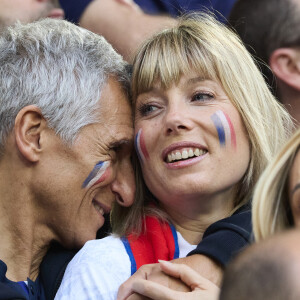 Et c'est en plein coeur de Paris qu'ils ont trouvé leur nid douillet idéal pour eux et leurs enfants.
Nagui et sa femme Mélanie Page - Célébrités dans les tribunes du match du groupe D de l'Euro 2024 entre l'équipe de France face à l'Autriche (1-0) à Dusseldorf en Allemagne le 17 juin 2024. © Cyril Moreau/Bestimage