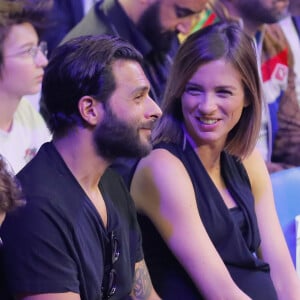 Maxim Nucci (Yodelice) et sa compagne enceinte Isabelle Ithurburu assistent au match de boxe de Tony Yoka au palais des sports de Paris, le 23 juin 2018 © Veeren-CVS/Bestimage