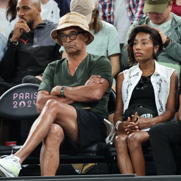 Yannick Noah et sa compagne Malika - Les célébrités en tribunes pendant l'épreuve de basketball de Demi-Finale opposant la France à l'Allemagne lors des Jeux Olympiques de Paris 2024 (JO) à l'Arena Bercy, à Paris, France, le 8 août 2024. © Jacovides-Perusseau/Bestimage  Celebrities in the stands during the Semi-Final basketball match between France and Germany during the Paris 2024 Olympic Games (Olympics) at the Arena Bercy in Paris, France, August 8, 2024. 