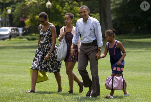 La famille Obama au complet en juillet 2010 à Washington : Michelle, Malia, Barack et Sasha