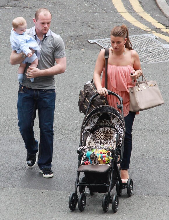 Wayne Rooney, son épouse Coleen et leur enfant Kai