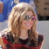 Fergie, à l'aéroport LAX de Los Angeles, procède aux contrôles de sécurité avant d'embarquer à bord d'un vol pour New York, samedi 12 février 2011.
