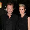 Johnny Hallyday et son épouse Laeticia lors de la soirée Christian Dior pré-Oscars, au Château Marmont à Los Angeles le 23 février 2011