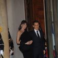 Carla Bruni-Sarkozy et son mari le président Nicolas Sarkozy à l'Elysée à Paris en mars 2011