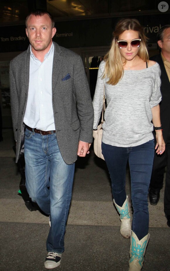 Guy Ritchie et sa petite-amie Jacqui Ainsley, enceinte, à Londres, le 14 mai 2011.