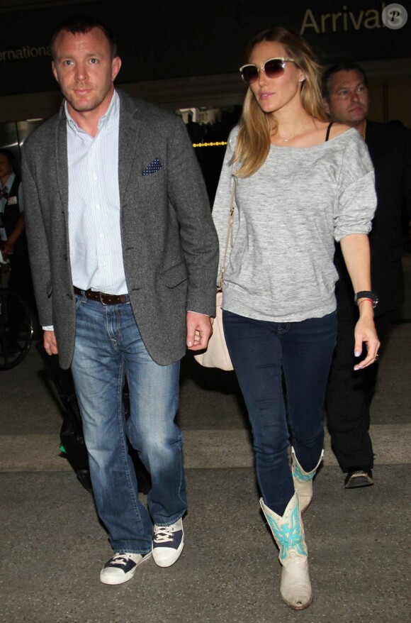 Guy Ritchie et sa compagne enceinte Jacqui Ainsley, à Londres, le 14 mai 2011.