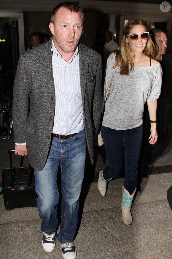 Guy Ritchie et sa compagne enceinte Jacqui Ainsley, à Londres, le 14 mai 2011.