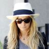 Ashley Tisdale se promène dans les rues de Los Angeles et se la joue rock-chic avec un chapeau Panama et des mini bottes cloutées. Los Angeles, le 27 juillet 2011.