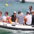 Elton John, Neil Patrick Harris, leurs compagnons et leurs bébés débarquent au club 55 à Saint-Tropez, le 4 août 2011.