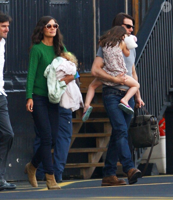 Katie Holmes, Tom Cruise et Suri vont prendre l'hélicoptère, à New York, le 9 août 2011.