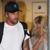 Pamela Anderson et son boyfriend Jon Rose, à l'aéroport de Sao Paulo, le 28 juillet 2011.