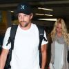 Pamela Anderson et son boyfriend Jon Rose, à l'aéroport de Sao Paulo, le 28 juillet 2011.