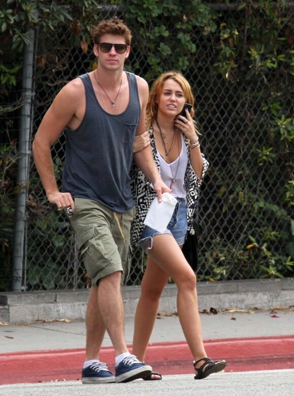 Liam Hemsworth et Miley Cyrus, à Los Angeles, le 7 août 2011.