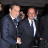 François Hollande et Nicolas Sarkozy se serrent la main au dîner du CRIF, à Paris, le 8 février 2012.