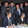 François Hollande à l'approche pour saluer Nicolas Sarkozy au dîner du CRIF, à Paris, le 8 février 2012.