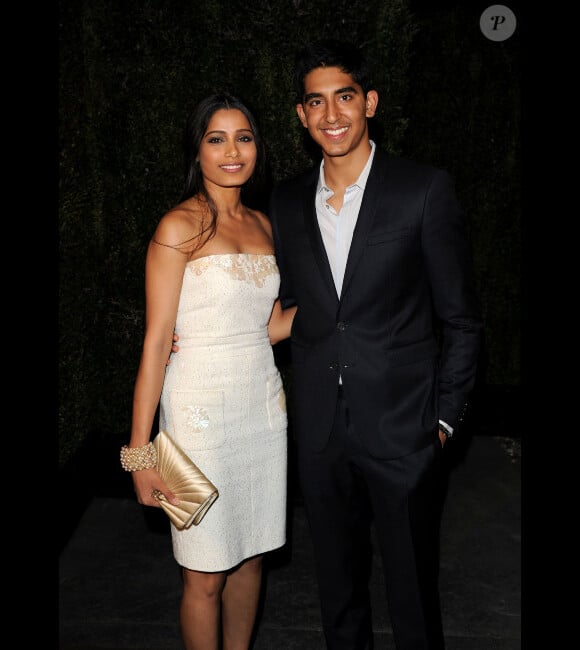 Freida Pinto et Dev Patel lors du dîner organisé par Chanel au restautant Madeo avant la cérémonie des Oscars le 25 février 2012 à Los Angeles