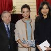 Jean Todt, Michelle Yeoh et sa fille à la cérémonie organisée à l'Élysée où le président a décoré onze  personnalités du monde des arts et du spectacle, le 14 mars 2012.