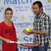 Priscilla et Bernard Montiel lors du tournoi de tennis pour l'association Enfant Star et Match à Paris le 26 mars 2012