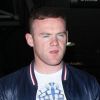 Wayne Rooney, le regard vide, et sa femme Coleen débarquent à Los Angeles le mardi 26 juin 2012