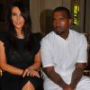 Kim Kardashian et Kanye West complices au premier rang du défilé Valentino à Paris le 4 juillet 2012