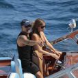 Christian Audigier et Nathalie Sorensen s'offrent une petite balade en bateau à Saint-Tropez, le dimanche 29 juillet 2012.