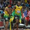 Usain Bolt remporte le 100m lors des Jeux olympiques de Londres le 5 août 2012 et conserve ainsi son titre avant d'aller le célébrer avec les spectateurs et Yohan Blake, médaillé d'argent sur la distance