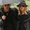 Jennifer Aniston et Justin Theroux en septembre 2011 à New York, sous la pluie.