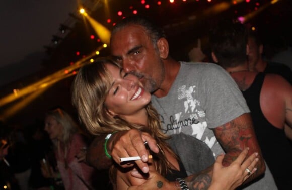 Très amoureux, Christian Audigier et sa douce Nathalie Sorensen font la fête à Ibiza le 9 août 2012