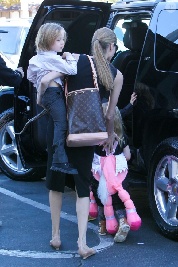 Angelina Jolie takes the kids out to shop for their Halloween costumes at a local Party City Store in Studio City, Los Angeles, CA, USA on October 28, 2012. The 37-year-old actress held tightly onto her twins, Vivienne Marcheline Jolie-Pitt and Knox Léon Jolie-Pitt, while her older daughter Shiloh Nouvel Jolie-Pitt picked out her own accessories. Photo by GSI/ABACAPRESS.COM29/10/2012 - Los Angeles