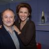 Patrick Braoudé et Corinne Touzet lors de la galette des rois au show room de Nicolas Feuillatte à Paris - février 2013