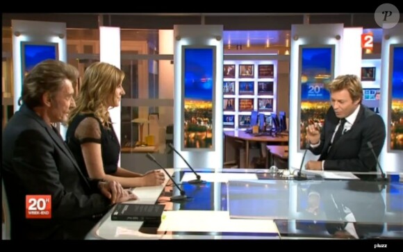 Johnny Hallyday et Amanda Sthers invités par Laurent Delahousse sur le plateau du 20 heures de France 2, le 9 février 2013.