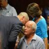 Carl et Henke Pistorius, le frère et le père d'Oscar Pistorius, au tribunal d'instance de Pretoria, troisième jour d'audience pour la demande de libération sous caution, le 21 février 2013.