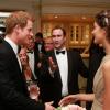 Le prince Harry rencontre les convives d'un dîner de gala à Johannesburg, en Afrique du Sud, le 27 février 2013, au profit de son association Sentebale pour les enfants du Lesotho.