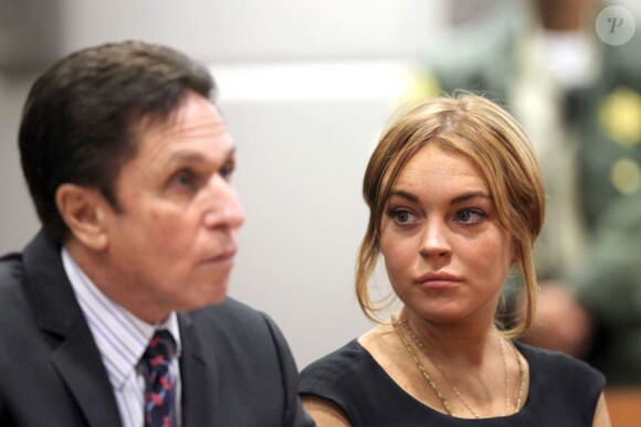 Lindsay Lohan et son avocat Mark Heller au tribunal de Los Angeles, le 30 janvier 2013. Le procès a été repoussé au 18 mars 2013.