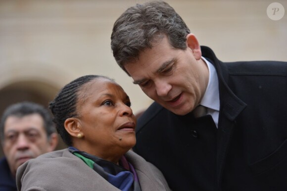 Christiane Taubira et Arnaud Montebourg lors de l'hommage national à Stéphane Hessel, à Paris le 7 mars 2013.