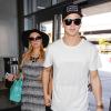 Paris Hilton et son petit-ami River Viiperi arrivent à l'aéroport de Los Angeles pour prendre un vol, le 20 mars 2013.