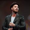M. Pokora chante la comédie musicale Robin des bois lors des Haidressing awards 2013 au carrousel du Louvre à Paris, le 24 mars 2013.