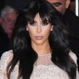 Kim Kardashian, habillée d'un top transparent en dentelle Valentino, d'une jupe Salvatore Ferragamo et de souliers Christian Louboutin, quitte l'hôtel Trump Soho et se dirige vers les studios d'ABC pour intervenir dans l'émission Good Morning America. New York, le 26 Mars 2013.