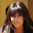 Kim Kardashian enceinte, habillée d'une veste et d'une robe en cuir Kanye West et de sandales Gucci, quitte le restaurant Cirpiani. New York, le 26 mars 2013.