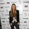 Elle Macpherson lors de la levée de fonds pour le programme The Dog Jogger de Barry Karacostas au 3 Cromwell Road. Londres, le 26 mars 2013.