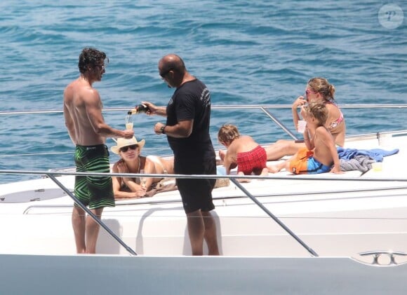Exclusif - NO WEB - NO BLOG - Patrick Dempsey en famille sur un yacht aux Caraïbes  For germany call for price - Please hide children face prior publication Exclusive - Patrick Dempsey and his family go for a swim off a yacht on May 17, 2013 while vacationing in the Caribbean. After cooling off in the water, Patrick swam back on board and rubbed sunscreen all over his wife Jill! NO INTERNET USE WITHOUT PRIOR AGREEMENT17/05/2013 - Caraibes