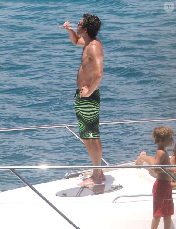 Exclusif - NO WEB - NO BLOG - Patrick Dempsey en famille sur un yacht aux Caraïbes  For germany call for price - Please hide children face prior publication Exclusive - Patrick Dempsey and his family go for a swim off a yacht on May 17, 2013 while vacationing in the Caribbean. After cooling off in the water, Patrick swam back on board and rubbed sunscreen all over his wife Jill! NO INTERNET USE WITHOUT PRIOR AGREEMENT17/05/2013 - Caraibes