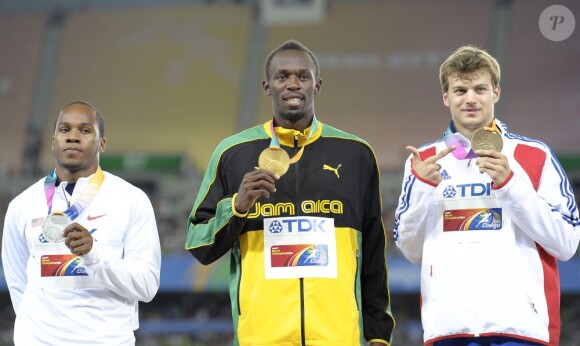 Usain Bolt, Walter Dix et Christophe Lemaître lors du podium du 200m lors des championnats du monde à Daegu le 4 septembre 2011