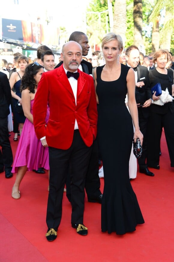Christian Louboutin et Melita Toscan Du Plantier sur le tapis rouge du Palais des Festivals pour la projection du film Le Passé, à la 66e édition du Festival de Cannes, le 17 mai 2013.