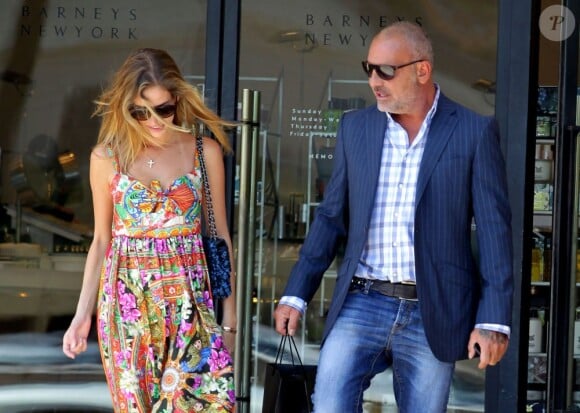 Christian Audigier et sa fiancée Nathalie Sorensen font du shopping à Beverly Hills, le 22 mai 2013.