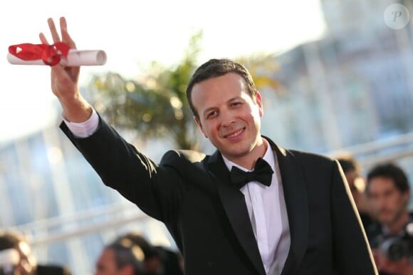 Amat Escalante (Prix de la mise en scène pour "Heli") au photocall de la remise des palmes lors du 66e Festival de Cannes, le 26 mai 2013.