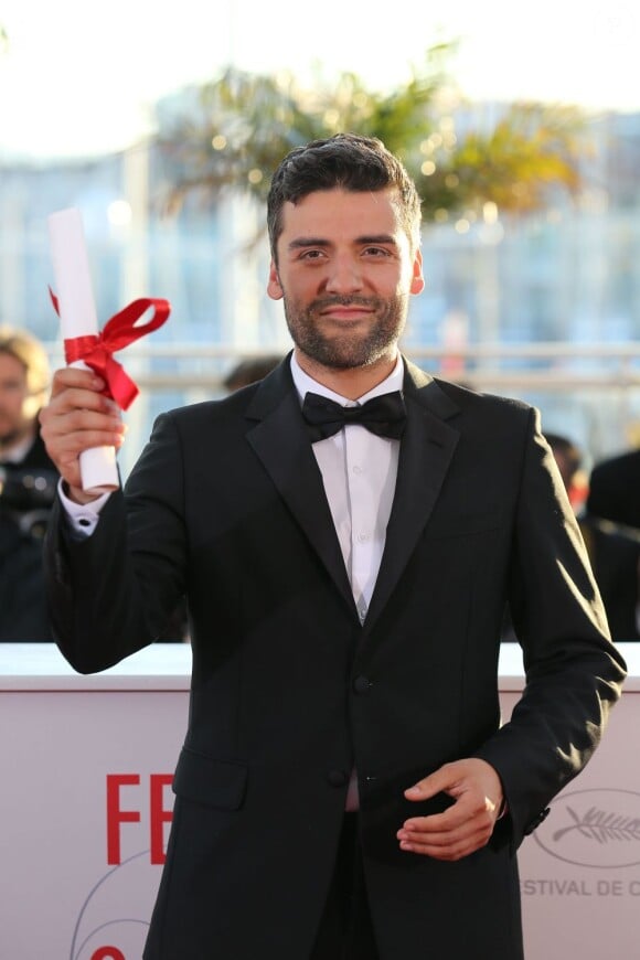 Oscar Isaac (Grand Prix du jury pour "Inside Llewyn Davis" de Ethan et Joel Coen)  au photocall de la remise des palmes lors du 66e Festival de Cannes, le 26 mai 2013.