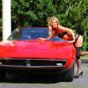 Nikki Leigh pose en petite tenue avec une Maserati Ghibli Spyder SS de 1970, à Brentwood, le 31 mai 2013. L'ex-playmate s'apprête justement à faire ses débuts au cinéma dans un film sur des pilotes de courses automobiles, Snake and Mongoose.