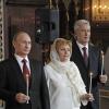 Prime Minister Vladimir Putin (L) with his wife Lyudmila and Moscow Mayor Sergei Sobyanin attend an Easter service in the Christ the Saviour Cathedral.